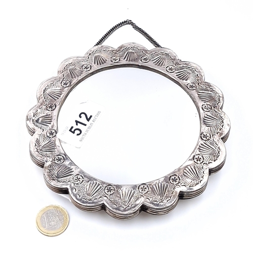 512 - A fine circular continental silver shell designed ladies mirror with suspension chain marked 'Ornek'... 