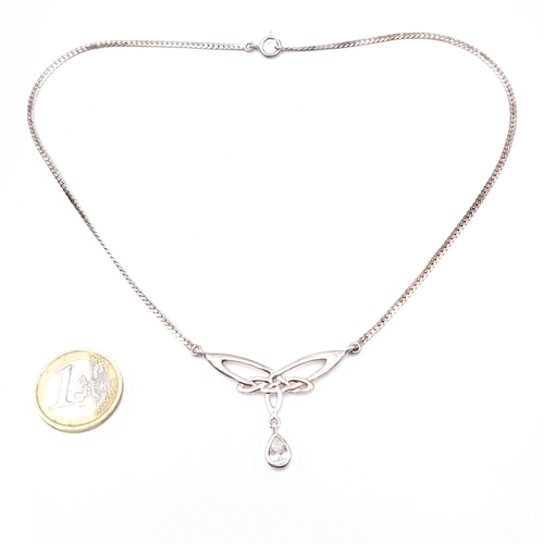 521 - A nice example of a Trinity knot pendant necklace set with a tear drop Zirconia stone accent. Length... 