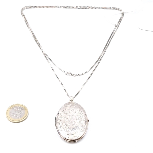 528 - A pretty large sterling silver hinged locket with foliette design together with a box link chain. Le... 