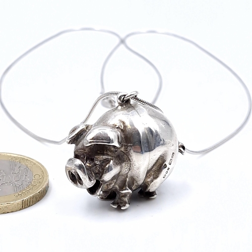 529 - A sterling silver pig hallmarked London with silver chain. Length - 40 cms. Total weight - 17.17 gra... 