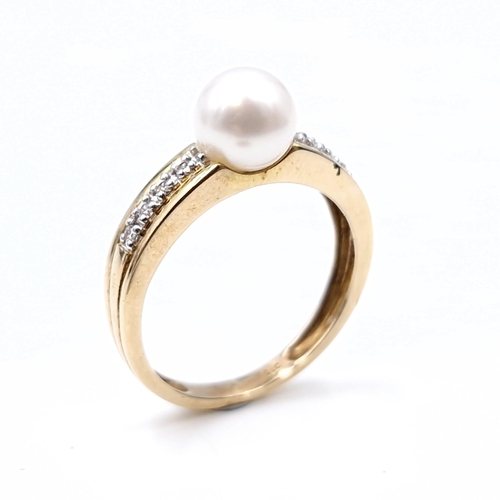 536 - A nine carat gold (375) gem set pearl ring. Ring size - L. Weight - 2.33 grams. Boxed.