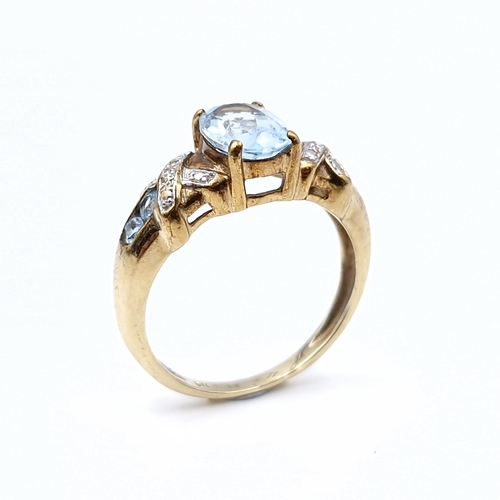 537 - Star Lot : A very nice example of a vintage nine carat gold (375) aquamarine and diamond ring. Diamo... 