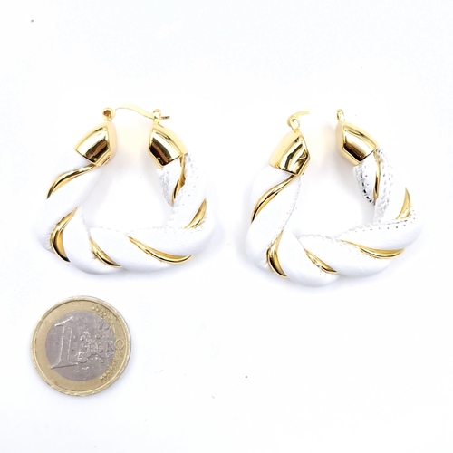 576 - A pair of designer  Bottega Veneta white and gold toned earrings. Weight - 33.5 grams.