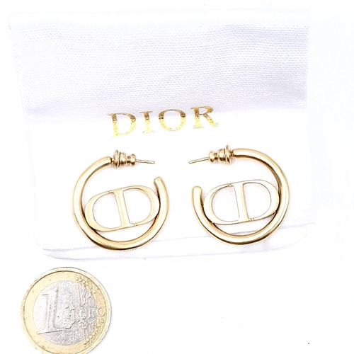 585 - A pair of brand new, designer Christian Dior hooped stud earrings. Weight - 9.12 grams. In a Christi... 