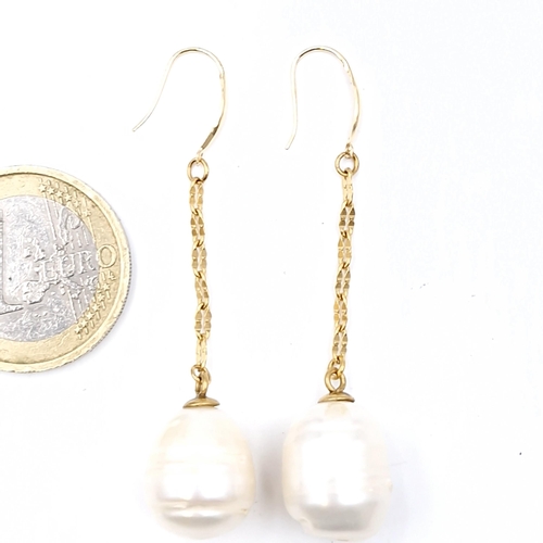 586 - Star Lot: A pair of brand new 18 carat gold akoya pearl stud earrings. Weight - 8.4 grams.