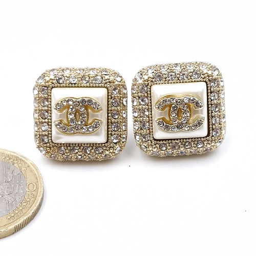 587 - Star Lot : A pair of original brand new designer Chanel gem set stud earrings. Weight - 19.83 grams.