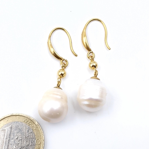 590 - Star Lot : A pair of brand new 18 carat gold akoya pearl earrings suitable for pierced ears. Weight ... 