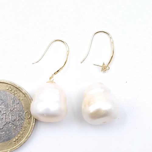 592 - A pair of 18 carat gold akoya pearl earrings suitable for pierced ears. Weight - 3.8 grams.