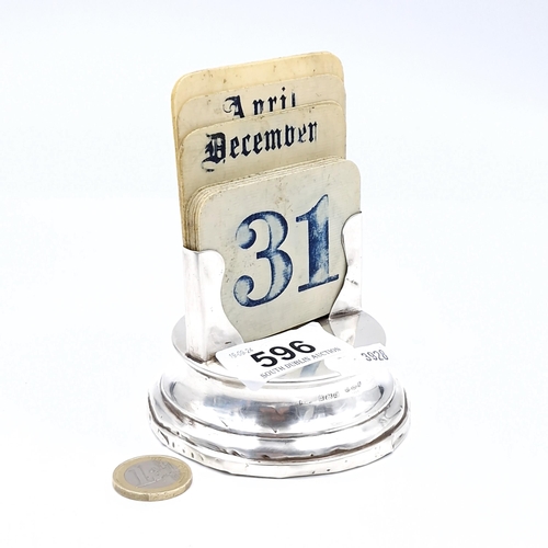 596 - A sterling silver vintage art deco calendar hallmarked Birmingham. Base dimensions - 9 cms diameter.... 