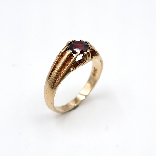 605 - Star lot : An antique heavy garnet stone ring with incised detailing to band mounted in nine carat g... 