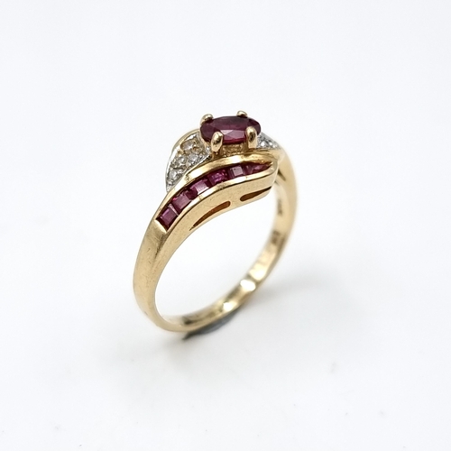 608 - Star lot : A diamond and ruby 14 carat gold ring. Size - H. Weight - 2.81 grams. Boxed.