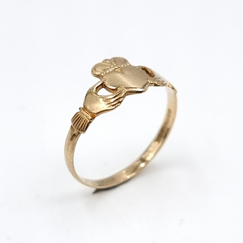 611 - A nine carat gold claddagh ring. Ring size - P. Weight - 1.33 grams. Boxed.