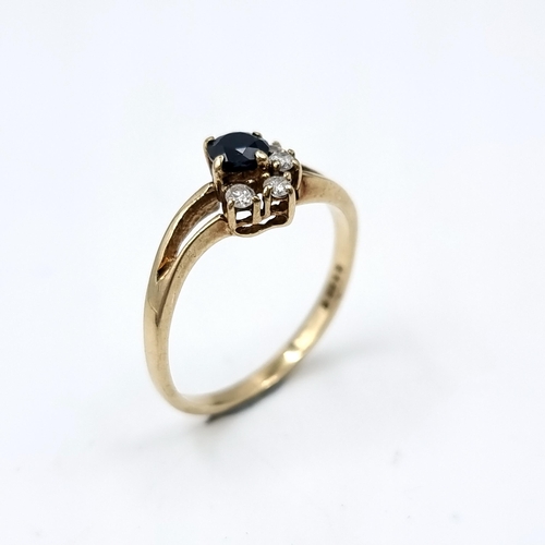 612 - Star Lot : A diamond and sapphire stone ring mounted in nine carat gold (375). Ring size - L. Weight... 