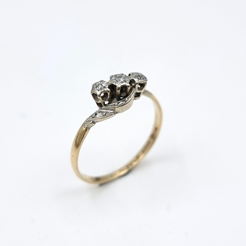 614 - A vintage 18 carat gold diamond three stone ring with twist diamond set mount. Ring size - R. Weight... 