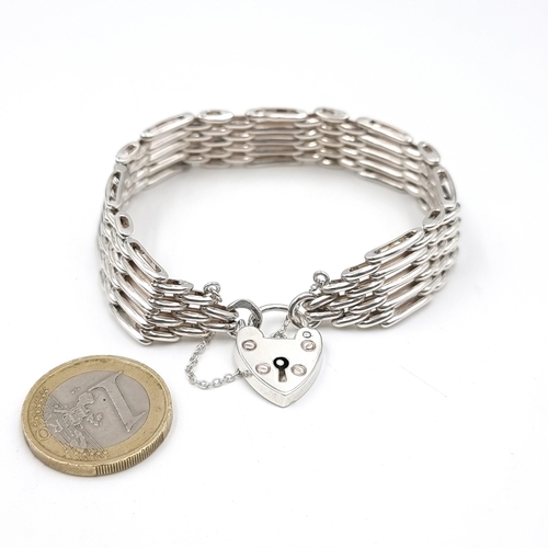 623 - A 1970s Sterling silver Gate Bracelet with Heart padlock. Weight: 20.88 grams