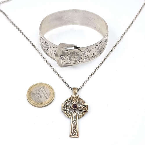 626 - A Past Times sterling silver necklace with Celtic silver cross and garnet stone pendant. Stamped sil... 