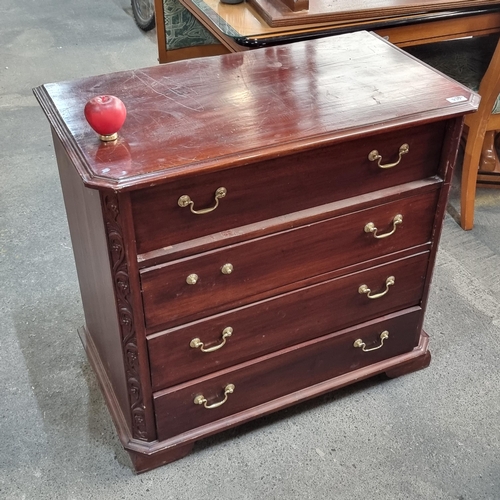 930 - An elegant chest with four full-length drawers featuring brass swan neck handles.