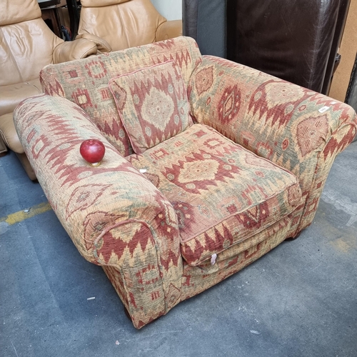 942 - A fabulous, very comfortable armchair with deep seat and matching cushion. Finished in a heavy woven... 