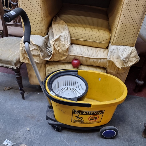 944 - Averyt good quality  industrial yellow mop bucket with wringer, complete with heavy-duty wheels. The... 