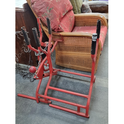 953 - A large red metal framed log holder / saw horse, With rooms for the logs and space for yto sit your ... 