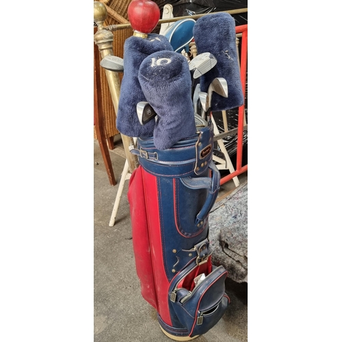 954 - A set of golf clubs including irons, 3, 5, 7 woods and a driver. Housed in a MacGregor bag and comes... 