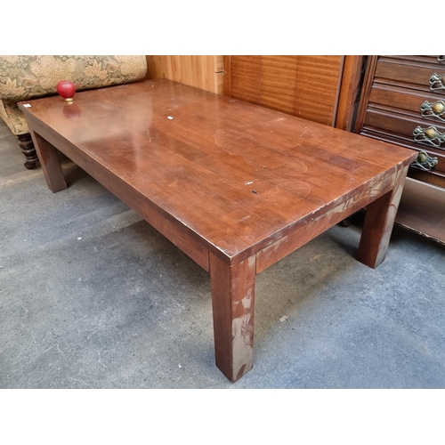 965 - A well made solid mahogany coffee table.