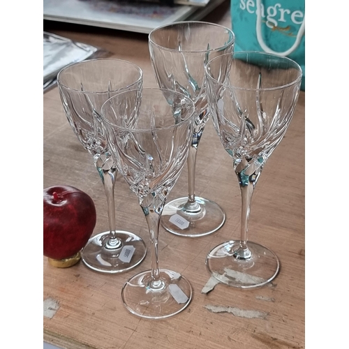 970 - Four very elegant, long stemmed cut glass wine glasses.