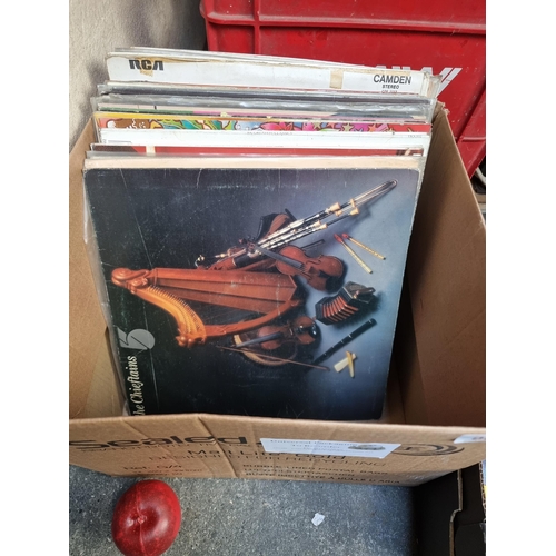 981 - A box containing a nice selection of vintage vinyl records from various artists