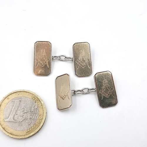 617 - An antique pair of sterling silver Masonic cuff links. Total Weight: 5.37 grams. Stamped ' SIL '.