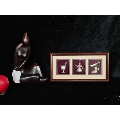 252 - Two items including a beautiful abstract figure of a poised sitting female along with a framed displ... 