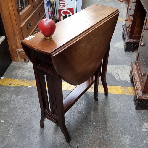 1040 - Star lot : A stunning, antique Narrow Oak drop-leaf table, featuring slatted sides and a lower stret... 