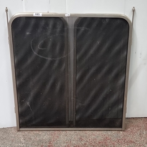 1043 - Three-panel metal mesh fireguard with folding sides and decorative finials. Previous in auction on 1... 