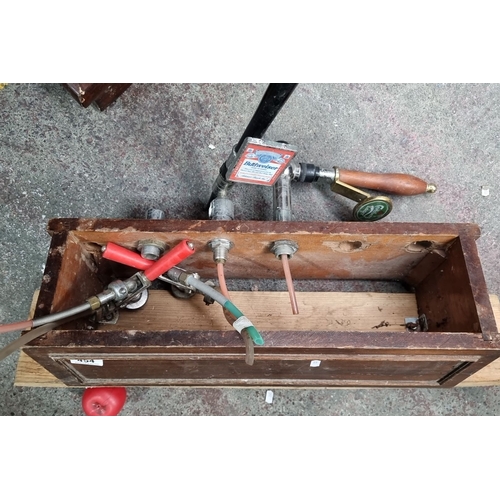 1046 - Vintage draught beer tap system features a wooden box enclosure with multiple tap connections, inclu... 