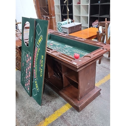 1047 - Star lot : Vintage wooden gaming table with craps, roulette  and blackjack layouts. Features multipl... 