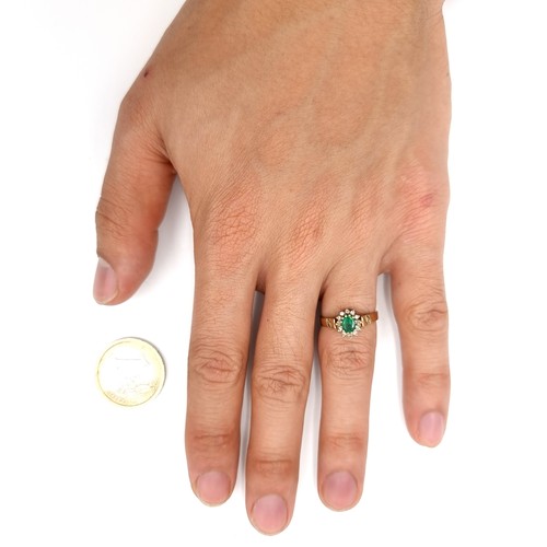 1085 - A diamond and large emerald ring set in nine carat gold. Size - K. Weight - 2.23 grams. Boxed.
Previ... 