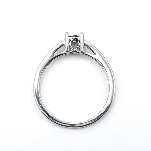 1087 - Star Lot : A fine diamond ring of 0.062 carats set in white gold (375) details stamped to band. In a... 