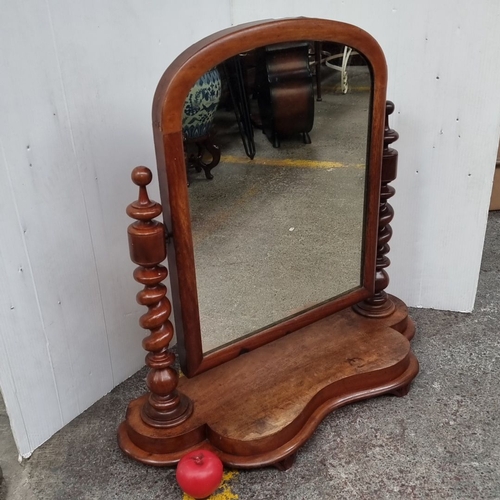 1097 - Victorian mahogany vanity mirror features elegant turned supports and a shaped base.
Previous in auc... 