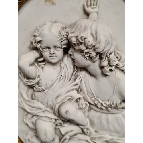 64 - Star Lot : A Neoclassical reconstituted marble plaque featuring two children originally by the sculp... 