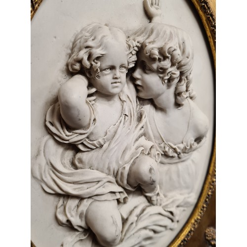 64 - Star Lot : A Neoclassical reconstituted marble plaque featuring two children originally by the sculp... 