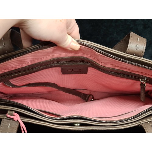 144 - A beautiful ladies brown leather handbag by Radley. In excellent condition. With the classic pink Le... 