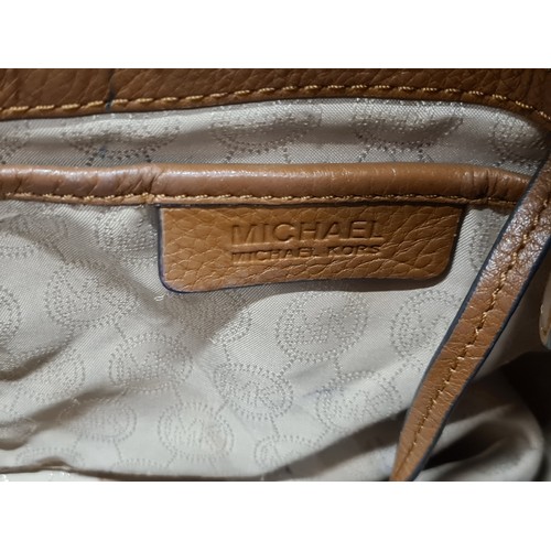 146 - A gorgeous original  ladies designer Michael Kors tan leather handbag.