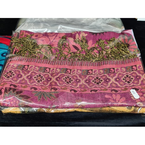 244 - A selection of brand new Ladies pashmina scarves. In unique colours and patterns. Features brands in... 