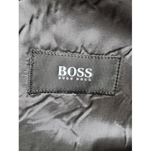 294 - Star Lot : A designer Hugo Boss designer 100% pure new wool navy coat. Size men's medium, women's la... 