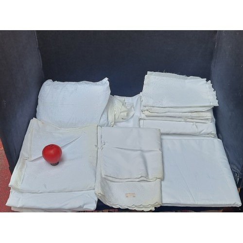 357 - A large box of vintage white table cloths and place mats with embroiderery.