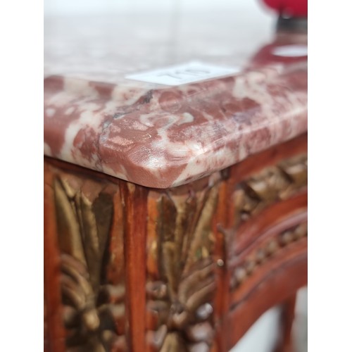 710 - Star Lot : A marble topped French style console table Featuring carved and turned wood tapering legs... 