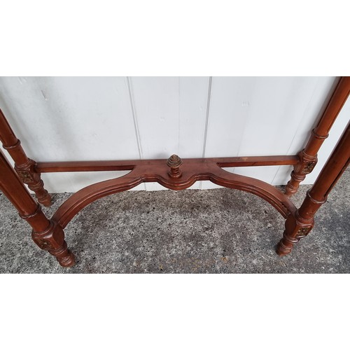 710 - Star Lot : A marble topped French style console table Featuring carved and turned wood tapering legs... 