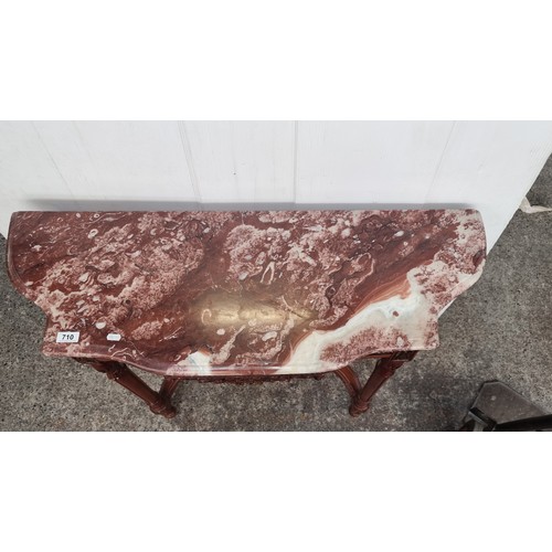 710 - Star Lot : A marble topped French style console table Featuring carved and turned wood tapering legs... 