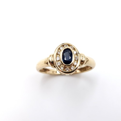 2 - Star lot : A nice example of a nine carat gold diamond and sapphire ring. Ring size - K. Weight - 1.... 