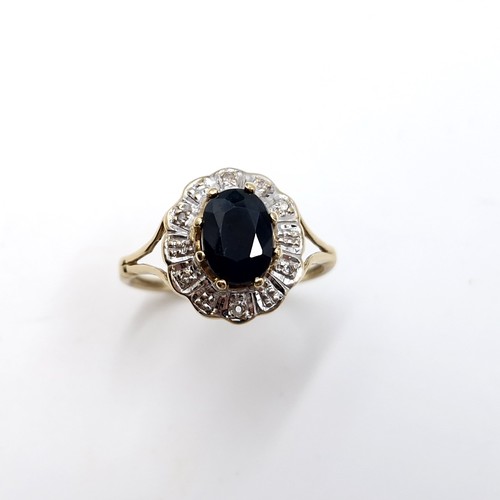 3 - Star Lot : A fine example of a large sapphire stone ring with diamond cluster surround set in nine c... 