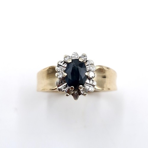 7 - Star lot : A nine carat gold diamond and sapphire stone ring with wide band mount. Size - L. Weight ... 